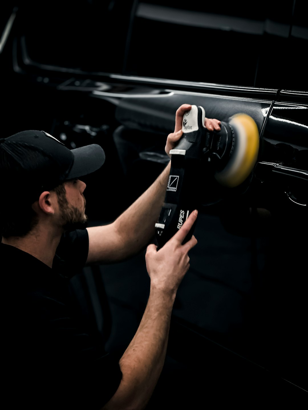 a-man-is-working-on-a-car-radio-m5lsl2e4ot0