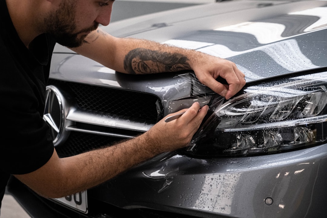 services-02 a-man-waxing-the-hood-of-a-car-dljelfmdpoc